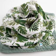 Four-layer muslin construction on the Little Unicorn Tropical Leaf quilt highlights breathable comfort.