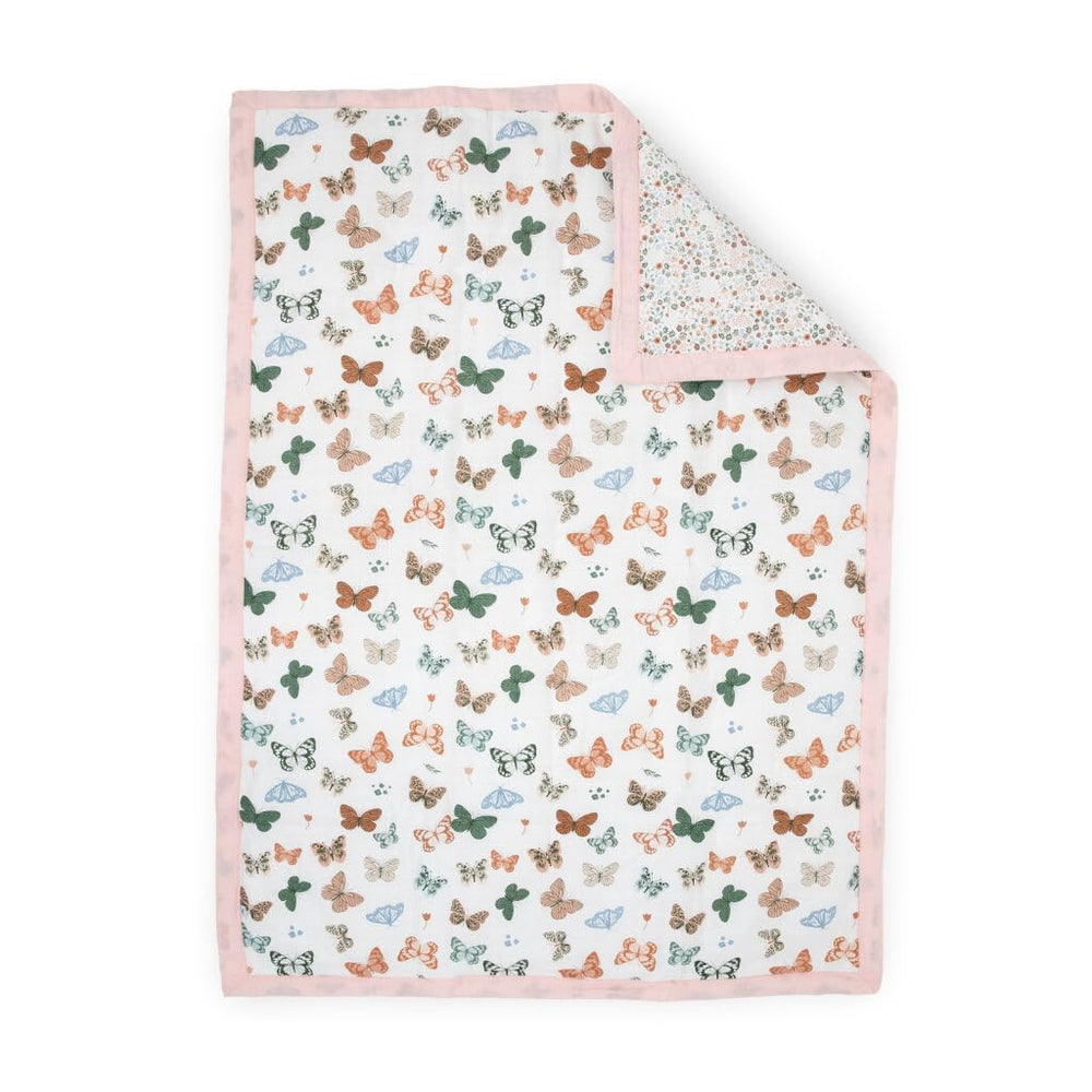 Little Unicorn Lofty Comforter butterflies close-up showing breathable muslin for gentle sleep.