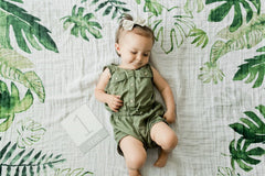 Little Unicorn milestone cards on blanket for documenting growth milestones