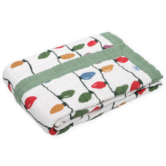 Little Unicorn muslin quilt designed for on-the-go snuggles and play.