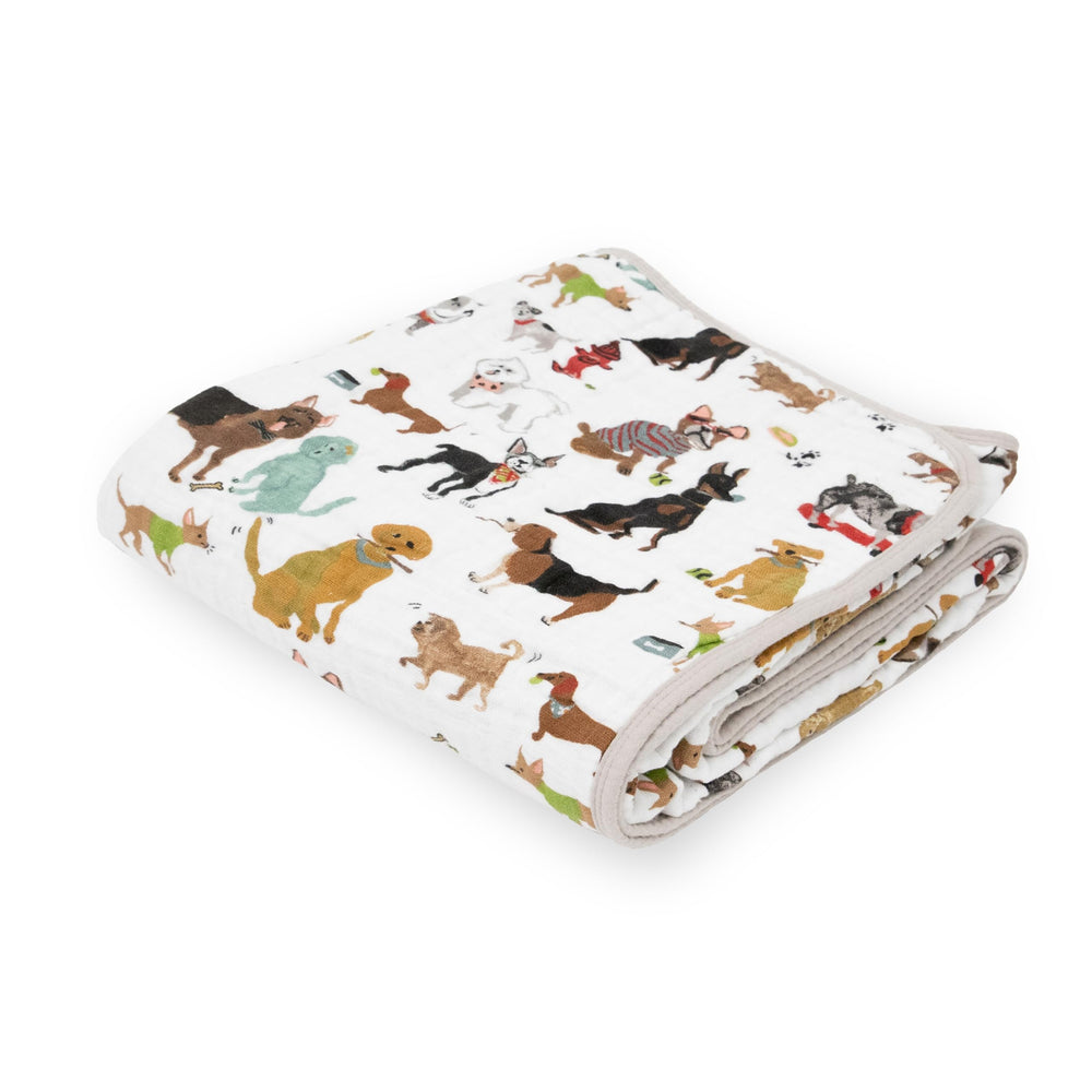 Little Unicorn muslin quilt blanket showing 4-layer warmth for cozy nursery cuddles.