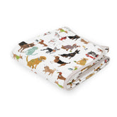 Little Unicorn muslin quilt blanket showing 4-layer warmth for cozy nursery cuddles.