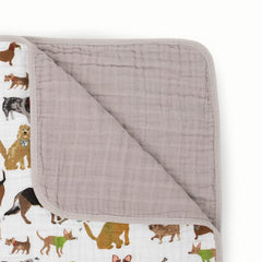 Little Unicorn quilt blanket used as stroller cover for on-the-go snuggles.