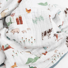 Little Unicorn muslin quilt car-seat wrap provides portable warmth for travel.