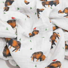 Nursery-ready Little Unicorn quilt adds soft texture and color to the crib.