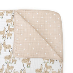 Little Unicorn Muslin Quilt stroller cover provides a gentle shield during outings.