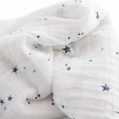 Little Unicorn swaddle blanket with baby swaddled, secure and comfortable.
