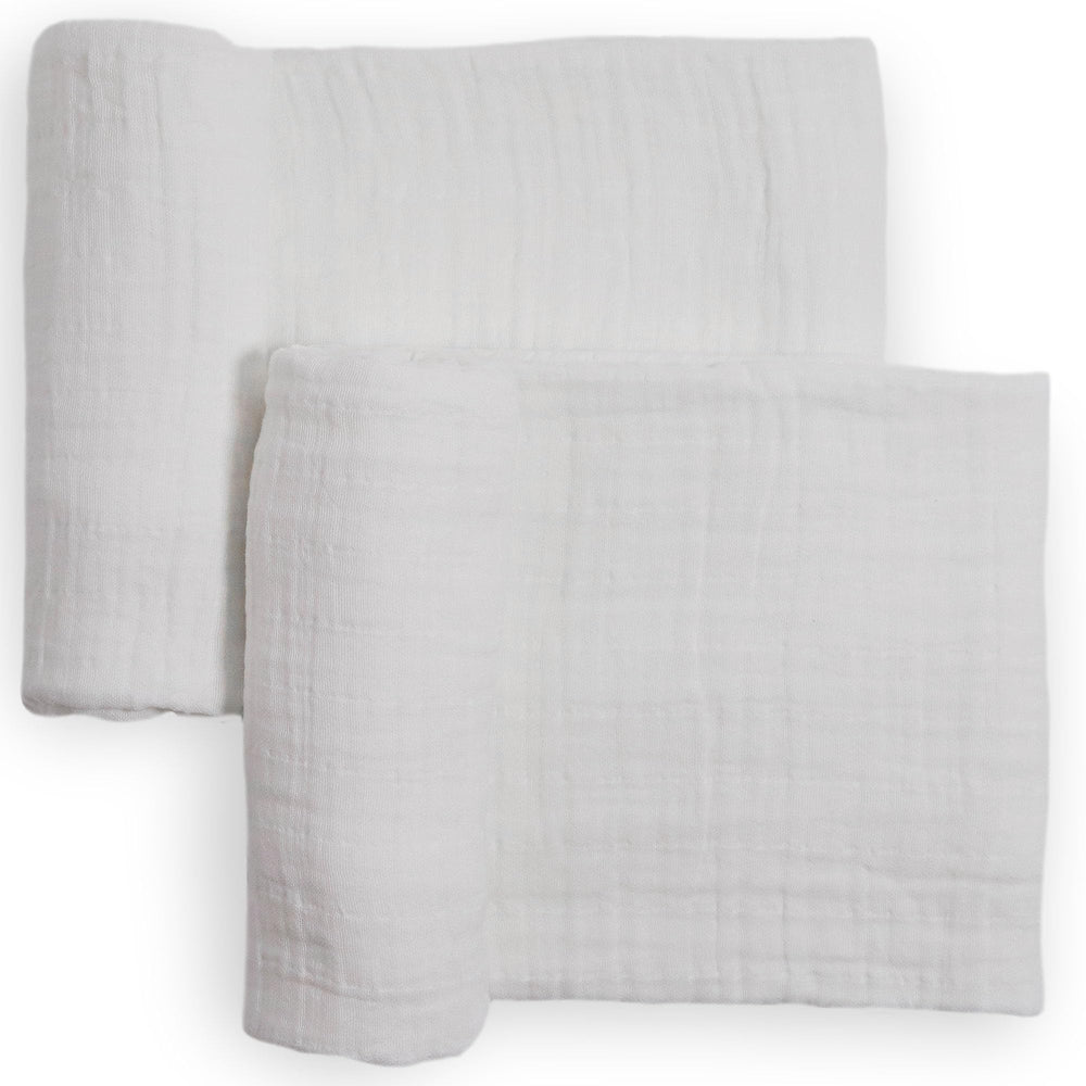 Little Unicorn muslin swaddle blanket white flatlay highlights breathable, soft cotton.