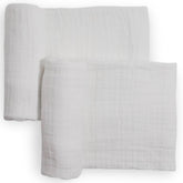 Little Unicorn muslin swaddle blanket white flatlay highlights breathable, soft cotton.