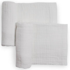 Little Unicorn muslin swaddle blanket white flatlay highlights breathable, soft cotton.