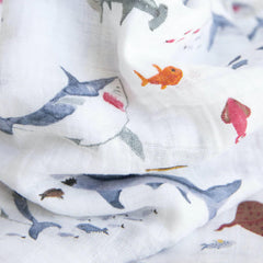Little Unicorn muslin swaddle solid color provides lightweight, easy-care comfort on the go.