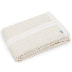 Little Unicorn newborn quilt used as stroller cover providing lightweight, breathable protection.