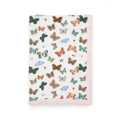 Little Unicorn newborn receiving quilt with butterfly print offers soft, breathable comfort for nap time.