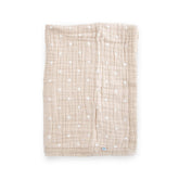 Little Unicorn newborn receiving quilt front view, taupe cross design for cozy snuggles.