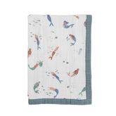 Little Unicorn mermaids quilt folded for a cozy cuddle on the go