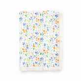Little Unicorn Mountain Bloom quilt closeup; ultra-soft muslin for cozy newborn cuddles.