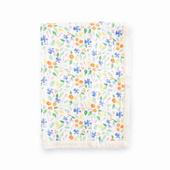 Little Unicorn Mountain Bloom quilt closeup; ultra-soft muslin for cozy newborn cuddles.