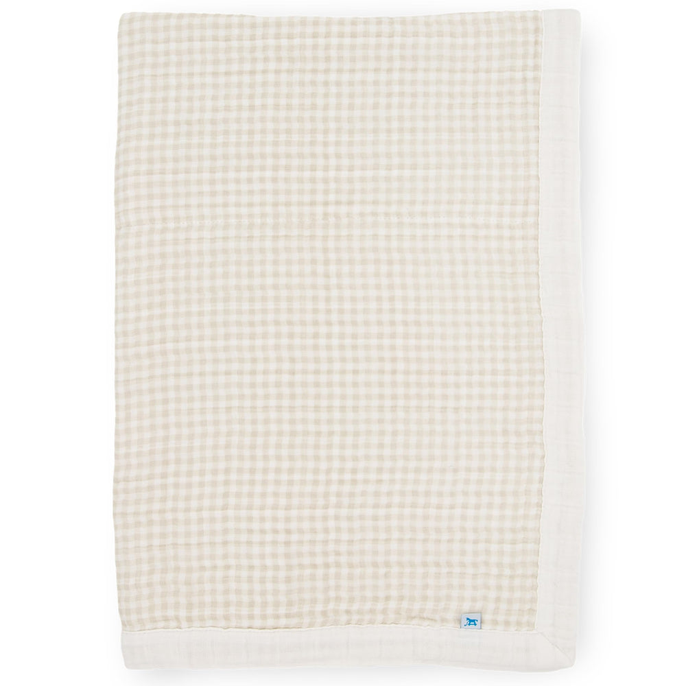 Little Unicorn newborn receiving quilt in soft muslin offers four-layer comfort for cuddles.