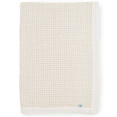 Little Unicorn newborn receiving quilt in soft muslin offers four-layer comfort for cuddles.