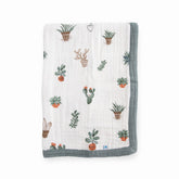 Little Unicorn newborn receiving quilt shows four-layer muslin softness for cozy snuggles.