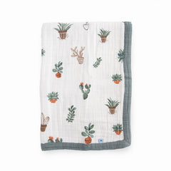 Little Unicorn newborn receiving quilt shows four-layer muslin softness for cozy snuggles.