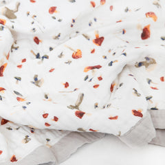 Little Unicorn quilt used as stroller cover for on-the-go comfort