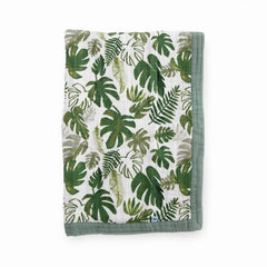 Little Unicorn newborn receiving quilt tropical leaf softness for cozy on-the-go cuddles.