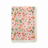 Little Unicorn newborn receiving quilt with ultra-soft muslin and four layers for cuddly warmth.
