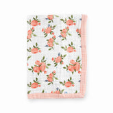 Little Unicorn newborn quilt with watercolor roses cover for stroller shade and cozy naps.