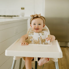 Whimsical prints on Little Unicorn bibs ideal for daily meals and nursery style