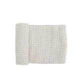 Little Unicorn premium cotton swaddle in tan gingham, breathable fabric for cozy swaddling.