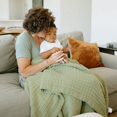 Little Unicorn Premium Quilted Throw Fern back view, reversible fabric for versatile styling