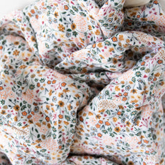 Little Unicorn Premium Quilted Throw used as stroller cover demonstrates on-the-go snuggles.