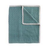 Little Unicorn premium quilted throw close-up of soft muslin for cozy naps.