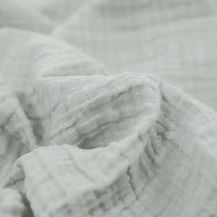 Little Unicorn muslin swaddle with pencil floral pattern for gentle wrapping