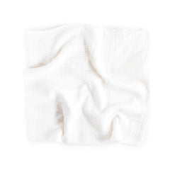 Little Unicorn swaddle close-up shows 100% cotton muslin texture for cozy swaddling.