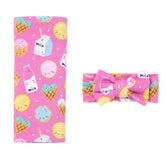 Little Sleepies swaddle blanket close-up in pink cookies & milk shows buttery-soft bamboo fabric.