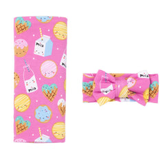 Little Sleepies swaddle blanket close-up in pink cookies & milk shows buttery-soft bamboo fabric.