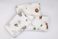 LMED Babyland muslin receiving cloth inside a diaper bag for on-the-go cleanups.