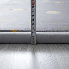 Loartee astral gray nursery rug offers a gentle surface for crawling and play.