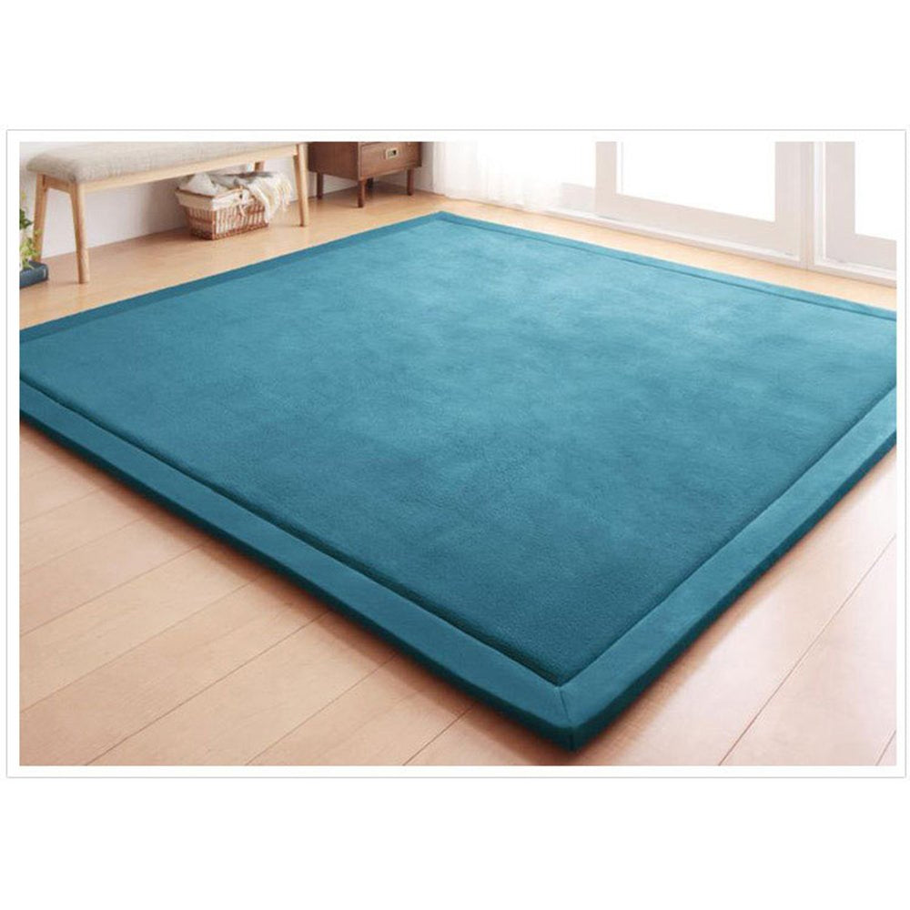 Loartee coral velvet crawling rug blue texture closeup showing soft surface for toddlers.