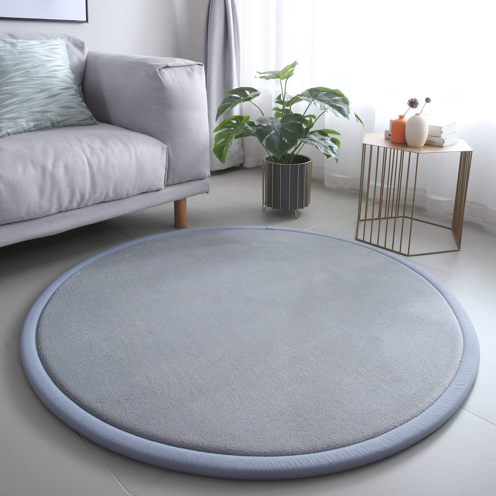 Loartee round rug in coral velvet offers soft 55-inch play space for kids.
