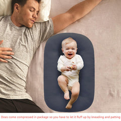Loevin baby lounger guardrails provide gentle support during playtime.