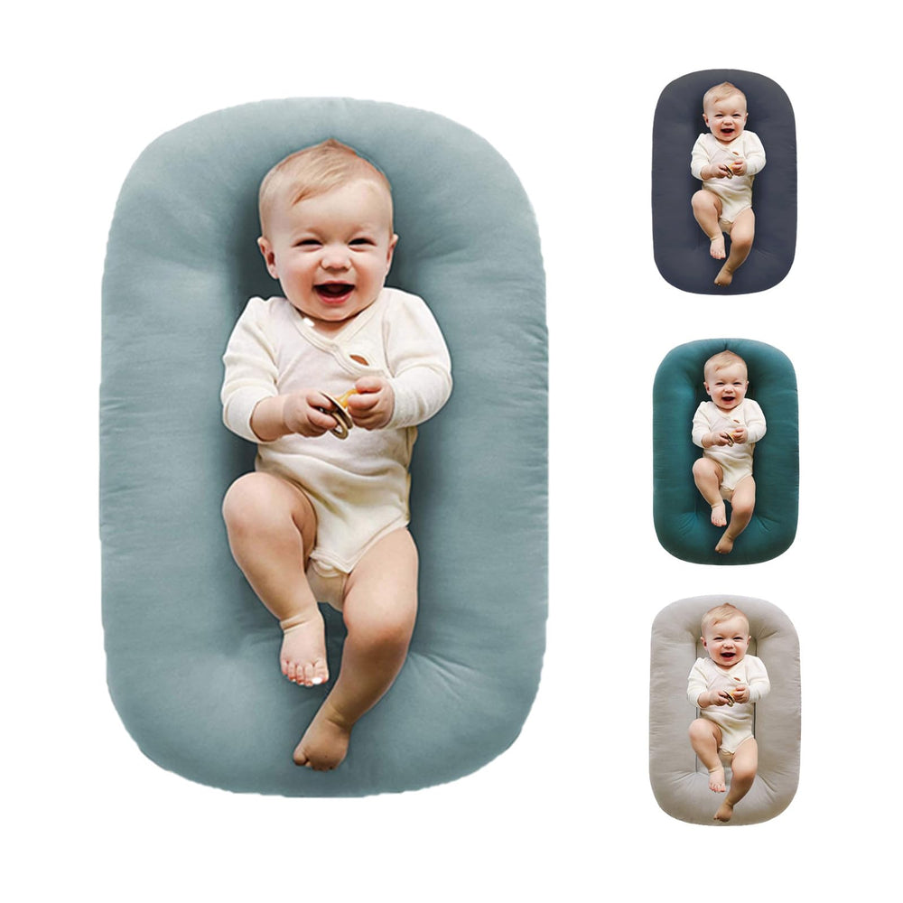 Loevin Baby Lounger Misty Blue close-up shows soft cotton cover for breathable comfort.