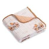 LollyBanks Noah's Ark pattern muslin blanket adds cozy nursery charm.