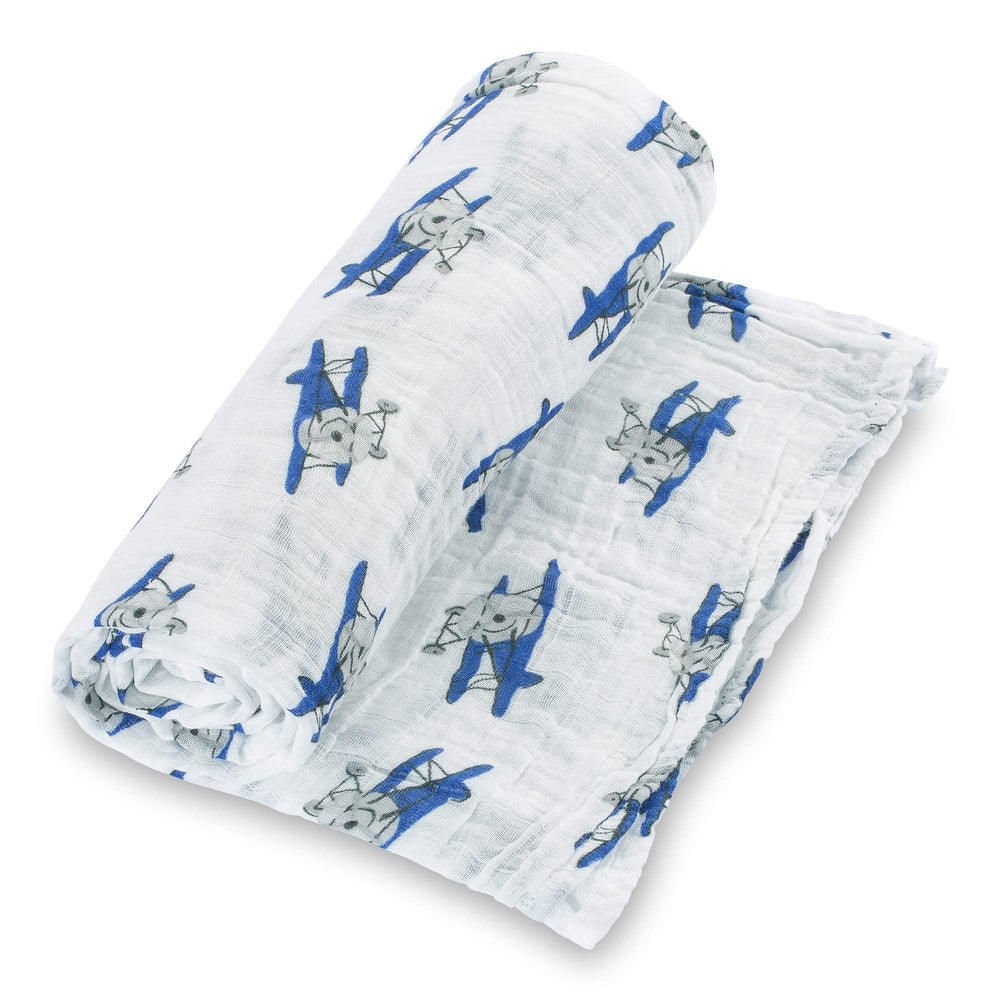 LollyBanks muslin swaddle airplane print, breathable wrap for newborn comfort.