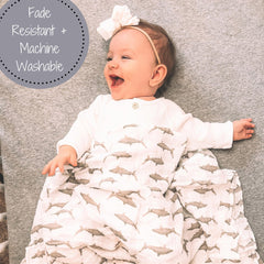 LollyBanks muslin swaddle close-up shows breathable soft fabric.