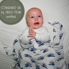 LollyBanks soft cotton muslin swaddle, gentle fabric for cozy snuggles.