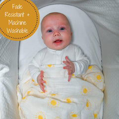 LollyBanks soft-muslin swaddle in sunshine design ideal for gentle newborn swaddling