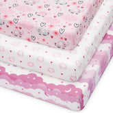 Looxii pack n play fitted sheet in pink cloud pattern for cozy baby sleep.